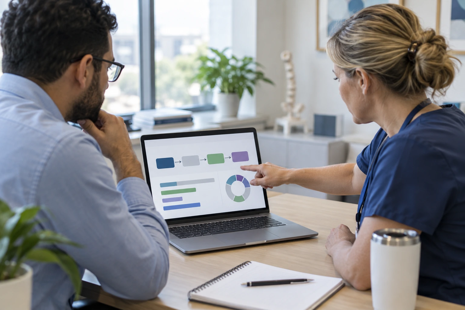 Mental health clinician and physician discussing coordinated patient support