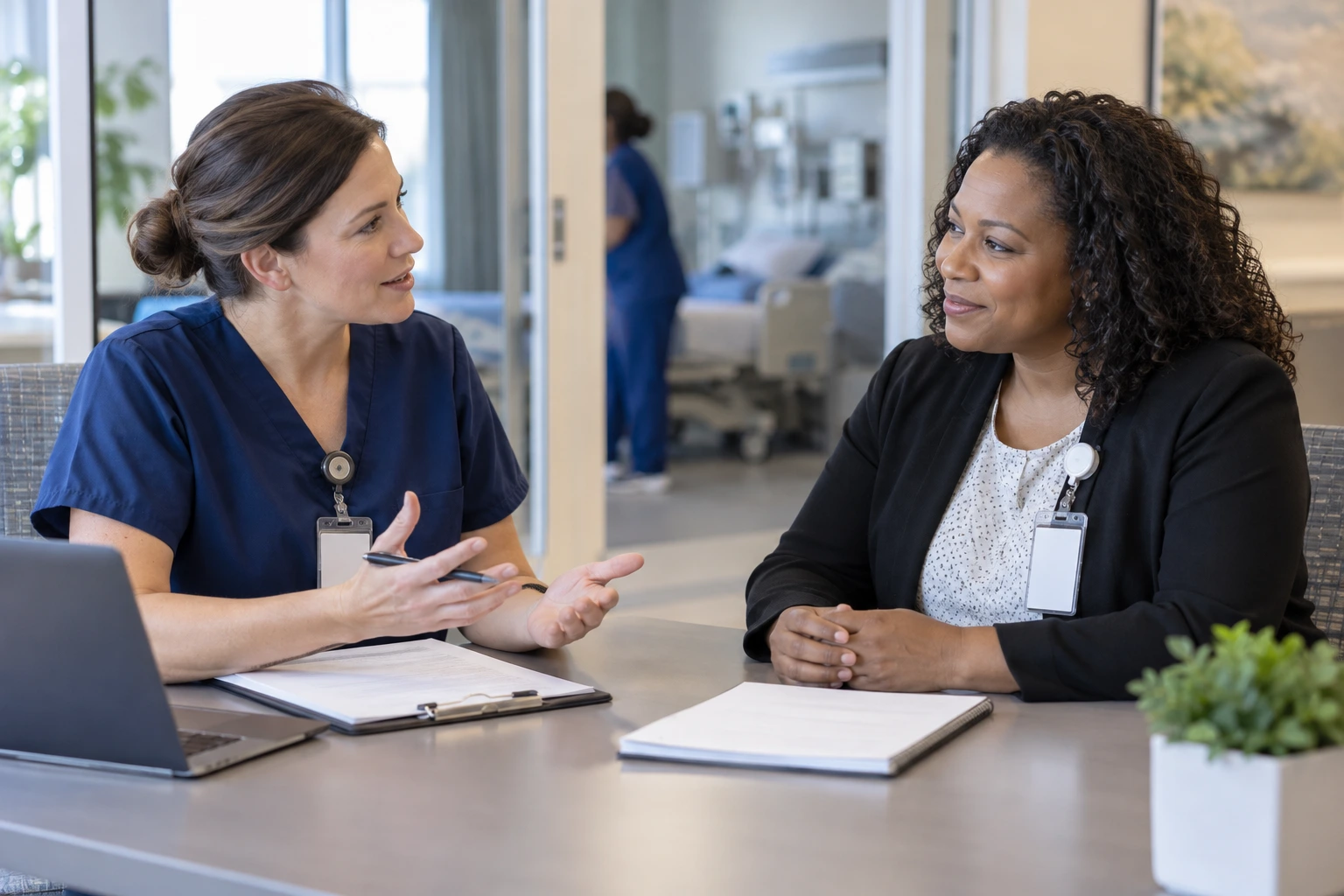 Hospital coordinator and home care representative discussing suitable referral partners